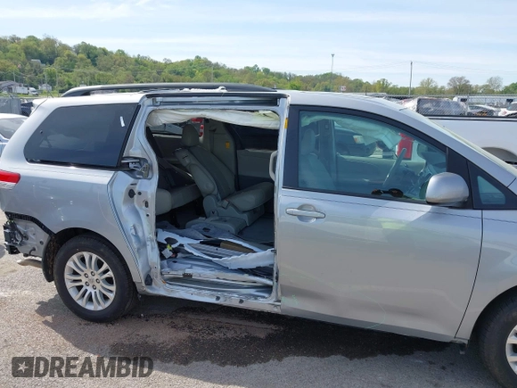2014 Toyota Sienna XLE with VIN 5TDYK3DC0ES451307, listed as a IAAI auction lot 42093569 with 105,721 mi miles and . Bid and sale history available at DreamBid. Image 6.