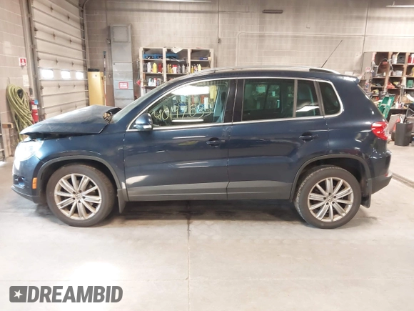 2011 Volkswagen Tiguan SE with VIN WVGBV7AXXBW533872, listed as a IAAI auction lot 40197835 with 104,685 mi miles and . Bid and sale history available at DreamBid. Image 14.