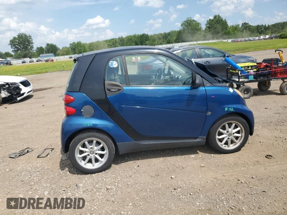 2009 Smart fortwo Pure with VIN WMEEJ31X59K218003, listed as a Copart auction lot 62413775 with 82,711 mi miles and Salvage title. Bid and sale history available at DreamBid. Image 3.