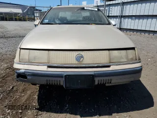 1990 Mercury Sable z VIN 1MECM50U6LG650642, wystawiony jako Copart lot #68279364 z przebiegiem 77 204 mil mil oraz Tytuł czysty. Historia ofert i sprzedaży dostępna na DreamBid. Obrazek 5.
