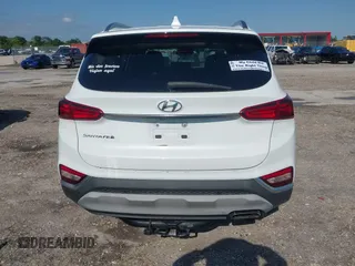 2019 Hyundai Santa Fe SEL with VIN 5NMS33AD6KH081690, listed as a IAAI auction lot 41961423 with 114,389 mi miles and . Bid and sale history available at DreamBid. Image 17.