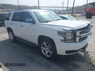 2015 Chevrolet Tahoe LS with VIN 1GNSCAEC7FR737717, listed as a IAAI auction lot 42110150 with 125,633 mi miles and . Bid and sale history available at DreamBid. Image 1.