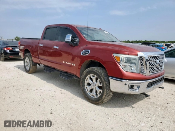 2016 Nissan Titan SL z VIN 1N6BA1F4XGN500750, wystawiony jako Copart lot #57608135 z przebiegiem 126 525 mil mil oraz Czysty tytuł • Clean title. Historia ofert i sprzedaży dostępna na DreamBid. Obrazek 4.