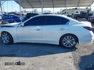 2014 Infiniti Q50 with VIN JN1BV7AP5EM678664, listed as a IAAI auction lot 41641222 with 86,385 mi miles and . Bid and sale history available at carsss.com. Image 14.