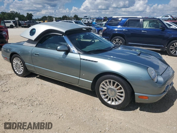 2004 Ford Thunderbird Pacific Coast Roadster with VIN 1FAHP63A04Y108766, listed as a Copart auction lot 74766964 with 30,107 mi miles and Salvage Title. Bid and sale history available at DreamBid. Image 4.