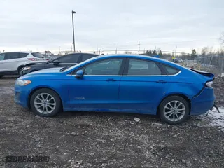 2019 Ford Fusion Hybrid SE with VIN 3FA6P0LUXKR131563, listed as a IAAI auction lot 41448736 with 165,440 mi miles. Bid and sale history available at carsss.com. Image 14.