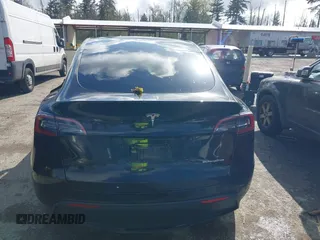 2022 Tesla Model Y Long Range with VIN 7SAYGDEEXNF459834, listed as a IAAI auction lot 42004576 with 56,175 mi miles and . Bid and sale history available at carsss.com. Image 16.