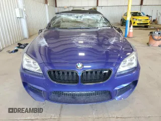 2015 BMW M6 z VIN WBSLZ9C54FD651463, wystawiony jako Copart lot #50922005 z przebiegiem Nie podano mil oraz Szkoda całkowita • Salvage title. Historia ofert i sprzedaży dostępna na DreamBid. Obrazek 5.