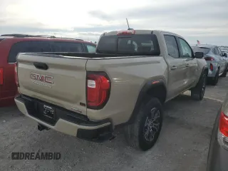 2023 GMC Canyon 4WD AT4 with VIN 1GTP6DEK3P1151112, listed as a Copart auction lot 77150454 with 5,573 mi miles and Non Repairable. Bid and sale history available at carsss.com. Image 3.