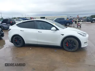 2022 Tesla Model Y Performance with VIN 7SAYGDEF1NF456829, listed as a IAAI auction lot 41448425 with 41,380 mi miles and . Bid and sale history available at DreamBid. Image 12.