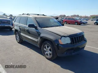 2010 Jeep Grand Cherokee Laredo with VIN 1J4PR4GK5AC160839, listed as a IAAI auction lot 41240116 with 143,097 mi miles. Bid and sale history available at carsss.com. Image 1.