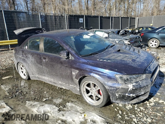 2014 Mitsubishi Lancer Evolution GSR z VIN JA32W8FV6EU010233, wystawiony jako Copart lot #42787275 z przebiegiem 74 780 mil mil oraz Szkody całkowita. Historia ofert i sprzedaży dostępna na DreamBid. Obrazek 4.
