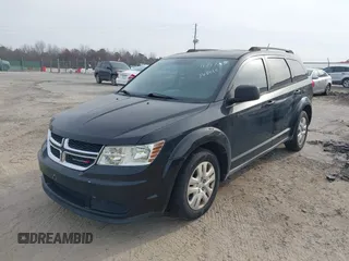 2013 Dodge Journey SE with VIN 3C4PDCAB0DT702977, listed as a IAAI auction lot 41797817 with 150,317 mi miles. Bid and sale history available at carsss.com. Image 2.