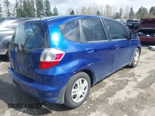 2010 Honda Fit with VIN JHMGE8H25AC009358, listed as a IAAI auction lot 41950158 with 162,019 mi miles. Bid and sale history available at carsss.com. Image 4.