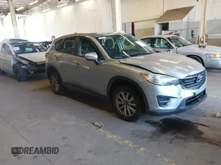 2016 Mazda CX-5 Sport with VIN JM3KE2BE5G0720507, listed as a IAAI auction lot 41872003 with 160,727 mi miles and . Bid and sale history available at carsss.com. Image 1.
