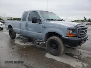 2000 Ford F-250 XL with VIN 1FTNX21F3YED35736, listed as a Copart auction lot 50309805 with 303,811 mi miles and Salvage title. Bid and sale history available at DreamBid. Image 4.