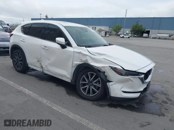 2018 Mazda CX-5 Grand Touring with VIN JM3KFADM1J0309995, listed as a IAAI auction lot 41977003 with 75,303 mi miles. Bid and sale history available at carsss.com. Image 1.