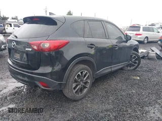 2016 Mazda CX-5 Grand Touring z VIN JM3KE4DY5G0742686, wystawiony jako IAAI lot #41598719 z przebiegiem 117 643 mil mil oraz . Historia ofert i sprzedaży dostępna na DreamBid. Obrazek 4.