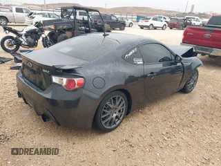 2013 Subaru BRZ Limited with VIN JF1ZCAC13D1610750, listed as a IAAI auction lot 41387911 with 95,518 mi miles. Bid and sale history available at carsss.com. Image 4.