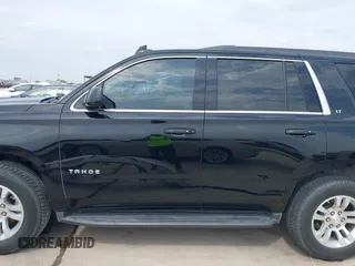 2019 Chevrolet Tahoe LT z VIN 1GNSCBKC0KR275635, wystawiony jako IAAI lot #42071241 z przebiegiem 158 621 mil mil oraz . Historia ofert i sprzedaży dostępna na DreamBid. Obrazek 14.
