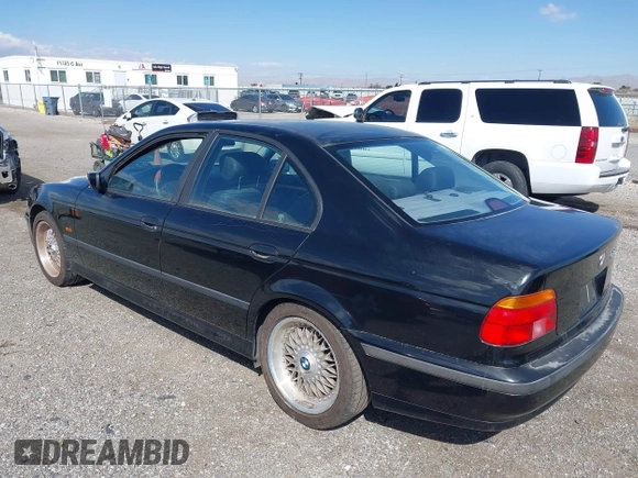 2000 BMW 5 Series 528iA with VIN WBADM6344YGU10257, listed as a IAAI auction lot 41773733 with 231,028 mi miles. Bid and sale history available at carsss.com. Image 3.