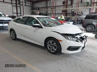 2016 Honda Civic Sedan LX with VIN 19XFC2F59GE028056, listed as a IAAI auction lot 41875940 with 124,243 mi miles. Bid and sale history available at carsss.com. Image 1.