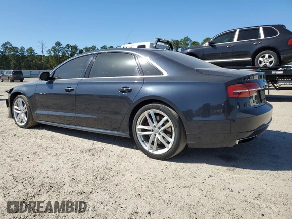 2016 Audi A8 L 4.0T Sport with VIN WAU43AFD2GN005588, listed as a Copart auction lot 76934794 with 133,813 mi miles and Salvage Title. Bid and sale history available at carsss.com. Image 2.