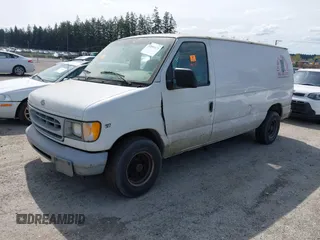 2000 Ford Econoline Cargo with VIN 1FTRE14W7YHA37668, listed as a IAAI auction lot 42001679 with 210,713 mi miles. Bid and sale history available at carsss.com. Image 2.