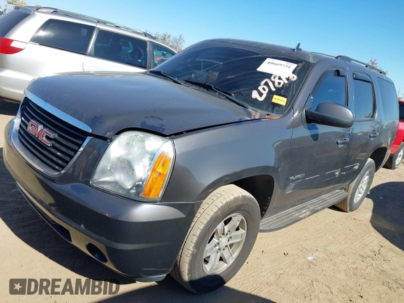 2011 GMC Yukon SLE with VIN 1GKS2AE04BR207818, listed as a IAAI auction lot 40669731 with 312,959 mi miles. Bid and sale history available at carsss.com. Image 2.