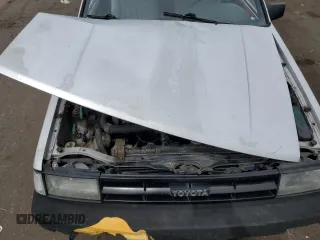 1986 Toyota Corolla с VIN JT2AE82E7G3353012, выставлен на аукционе Copart как лот 68646544 с пробегом 176 256 миль миль и Чистый • Clean title. История ставок и продаж доступна на DreamBid. Изображение 13.