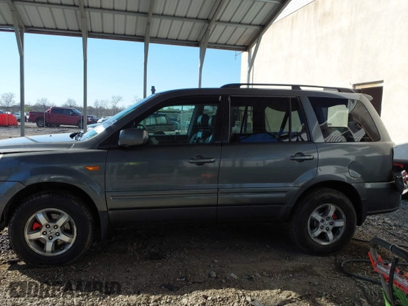 2007 Honda Pilot EX-L with VIN 5FNYF18777B012649, listed as a IAAI auction lot 42070873 with 167,419 mi miles and . Bid and sale history available at DreamBid. Image 14.
