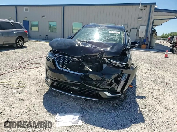 2024 Cadillac XT6 Premium Luxury z VIN 1GYKPERS1RZ755490, wystawiony jako Copart lot #49706575 z przebiegiem 4 239 mil mil oraz Szkoda całkowita • Salvage title. Historia ofert i sprzedaży dostępna na DreamBid. Obrazek 14.