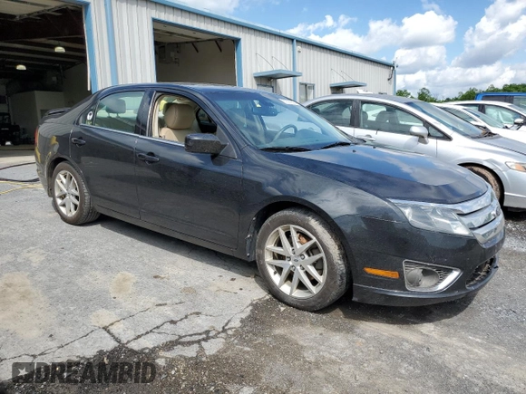 2012 Ford Fusion SEL z VIN 3FAHP0JG4CR388483, wystawiony jako Copart lot #57391805 z przebiegiem 184 665 mil mil oraz Szkoda całkowita • Salvage title. Historia ofert i sprzedaży dostępna na DreamBid. Obrazek 4.