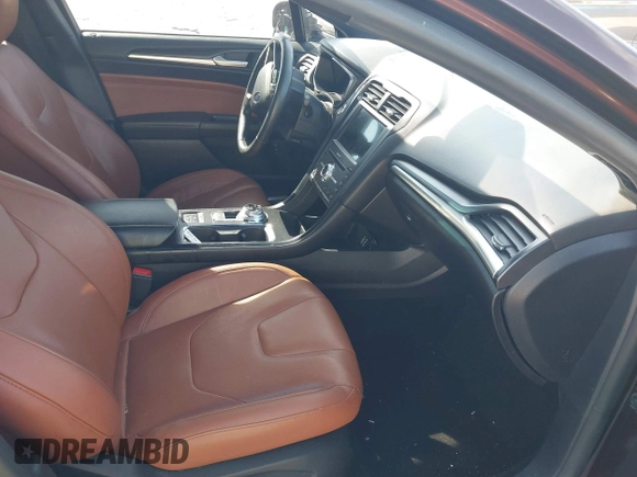 2019 Ford Fusion Hybrid Titanium with VIN 3FA6P0RU2KR123786, listed as a IAAI auction lot 41857026 with 49,604 mi miles. Bid and sale history available at carsss.com. Image 5.