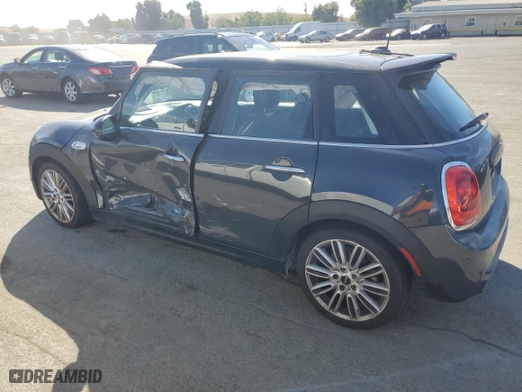 2015 MINI Cooper Hardtop 4 Door S with VIN WMWXU3C59F2B65795, listed as a Copart auction lot 75768864 with 120,979 mi miles and Salvage Title. Bid and sale history available at carsss.com. Image 2.