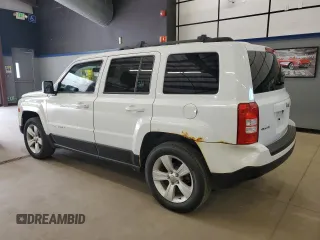2014 Jeep Patriot Latitude with VIN 1C4NJRFB3ED766143, listed as a Copart auction lot 57879215 with 145,733 mi miles and Clean title. Bid and sale history available at DreamBid. Image 2.