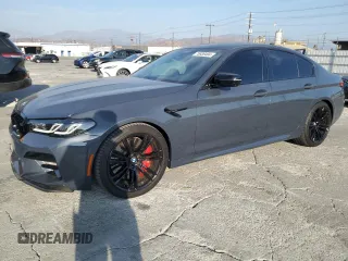 2022 BMW M5 z VIN WBS83CH06NCH65232, wystawiony jako Copart lot #75938404 z przebiegiem 20 163 mil mil oraz Szkoda całkowita • Salvage title. Historia ofert i sprzedaży dostępna na DreamBid. Obrazek 1.