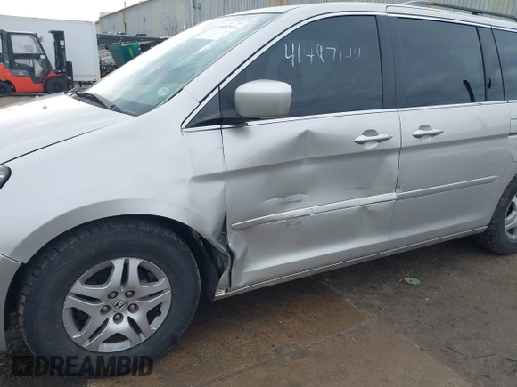 2006 Honda Odyssey EX-L z VIN 5FNRL38766B018014, wystawiony jako IAAI lot #41497144 z przebiegiem 230 225 mil mil oraz . Historia ofert i sprzedaży dostępna na DreamBid. Obrazek 6.