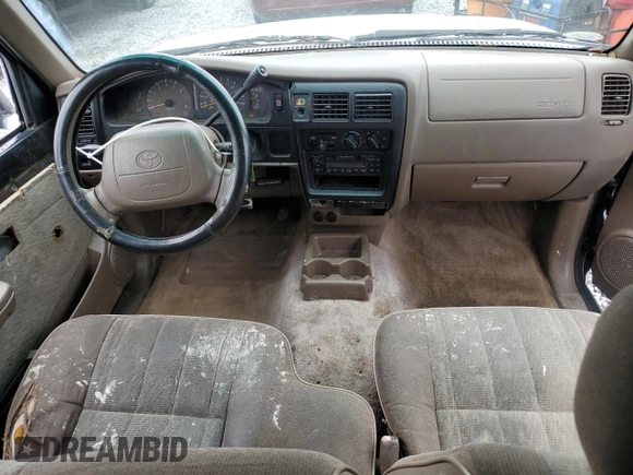 1999 Toyota Tacoma z VIN 4TAVL52N8XZ435689, wystawiony jako Copart lot #52162105 z przebiegiem 2 317 301 mil mil oraz Szkoda całkowita • Salvage title. Historia ofert i sprzedaży dostępna na DreamBid. Obrazek 8.