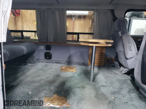 1988 Chevrolet Chevy Van z VIN 2GBEG25K2J4137750, wystawiony jako Copart lot #89310475 z przebiegiem 26 823 mil mil oraz Szkoda całkowita • Salvage title. Historia ofert i sprzedaży dostępna na DreamBid. Obrazek 11.