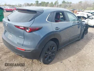 2023 Mazda CX-30 S Carbon Edition with VIN 3MVDMBCM8PM502891, listed as a IAAI auction lot 42050533 with 20,035 mi miles and . Bid and sale history available at DreamBid. Image 4.