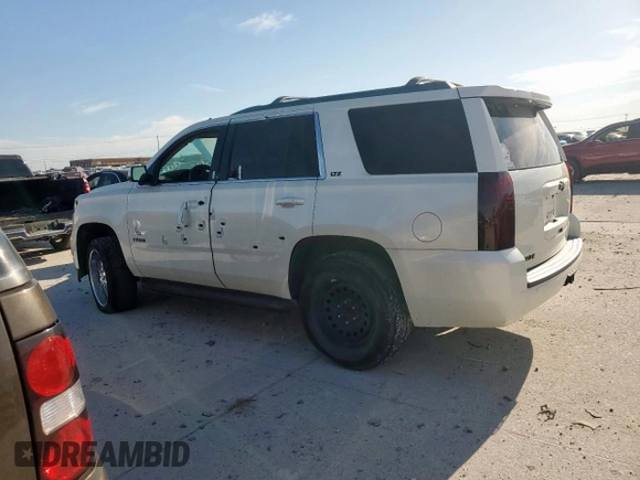 2015 Chevrolet Tahoe LT z VIN 1GNSCBKC0FR159342, wystawiony jako Copart lot #58051145 z przebiegiem 156 440 mil mil oraz Czysty tytuł • Clean title. Historia ofert i sprzedaży dostępna na DreamBid. Obrazek 2.