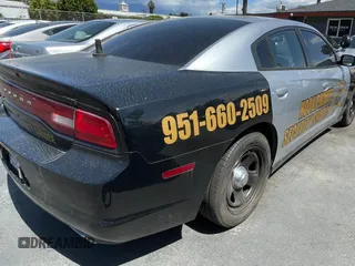 2012 Dodge Charger Police with VIN 2C3CDXAG0CH295515, listed as a Copart auction lot 51870315 with 128,837 mi miles and Clean Title. Bid and sale history available at carsss.com. Image 4.