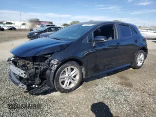 2021 Toyota Corolla Hatchback SE with VIN JTND4MBE4M3115822, listed as a Copart auction lot 77622034 with 83,268 mi miles and Salvage Title. Bid and sale history available at carsss.com. Image 1.
