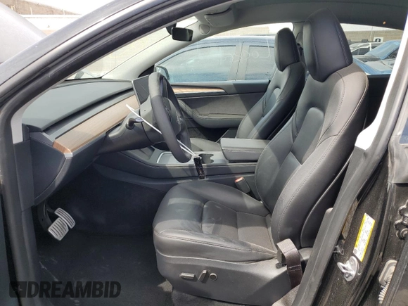 2023 Tesla Model Y Performance with VIN 7SAYGDEF7PF924355, listed as a Copart auction lot 47877055 with 64,663 mi miles and Salvage Title. Bid and sale history available at DreamBid. Image 7.