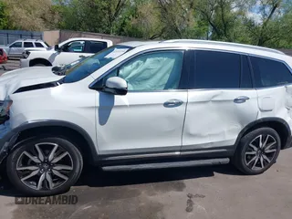 2021 Honda Pilot Touring 8-Passenger z VIN 5FNYF6H94MB087593, wystawiony jako IAAI lot #42153310 z przebiegiem 30 400 mil mil oraz . Historia ofert i sprzedaży dostępna na DreamBid. Obrazek 14.