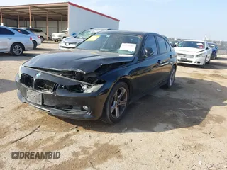 2013 BMW 3 Series 328i with VIN WBA3C1C51DF440679, listed as a IAAI auction lot 41533587 with 184,812 mi miles. Bid and sale history available at carsss.com. Image 2.