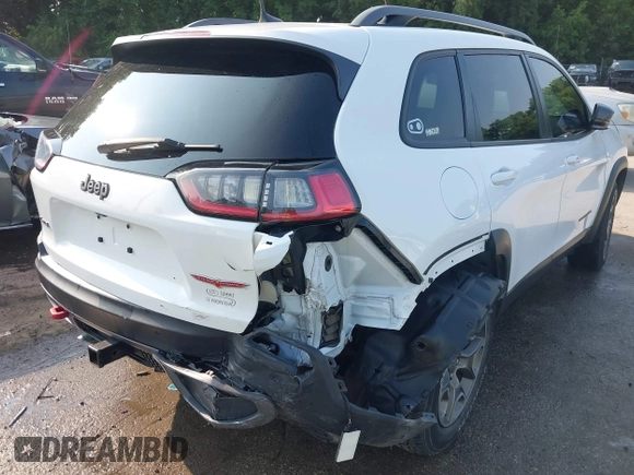 2021 Jeep Cherokee Trailhawk with VIN 1C4PJMBX4MD124980, listed as a IAAI auction lot 42372537 with 55,667 mi miles and . Bid and sale history available at DreamBid. Image 6.