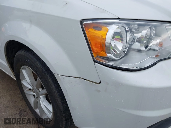 2015 Dodge Grand Caravan SXT with VIN 2C4RDGCG2FR548433, listed as a IAAI auction lot 42121256 with 161,459 mi miles and . Bid and sale history available at DreamBid. Image 12.