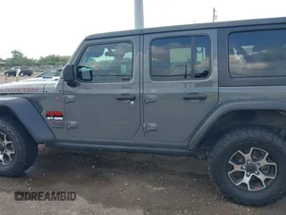 2020 Jeep Wrangler Unlimited Rubicon z VIN 1C4HJXFG7LW193665, wystawiony jako IAAI lot #41874930 z przebiegiem 58 884 mil mil oraz . Historia ofert i sprzedaży dostępna na DreamBid. Obrazek 14.